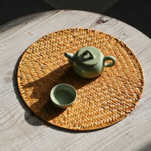 Round woven seagrass placemat with natural brown texture